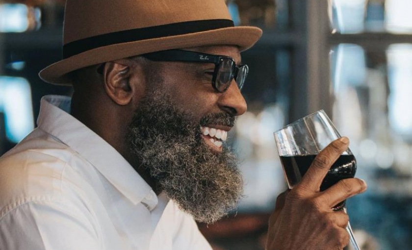 a man drinking wine